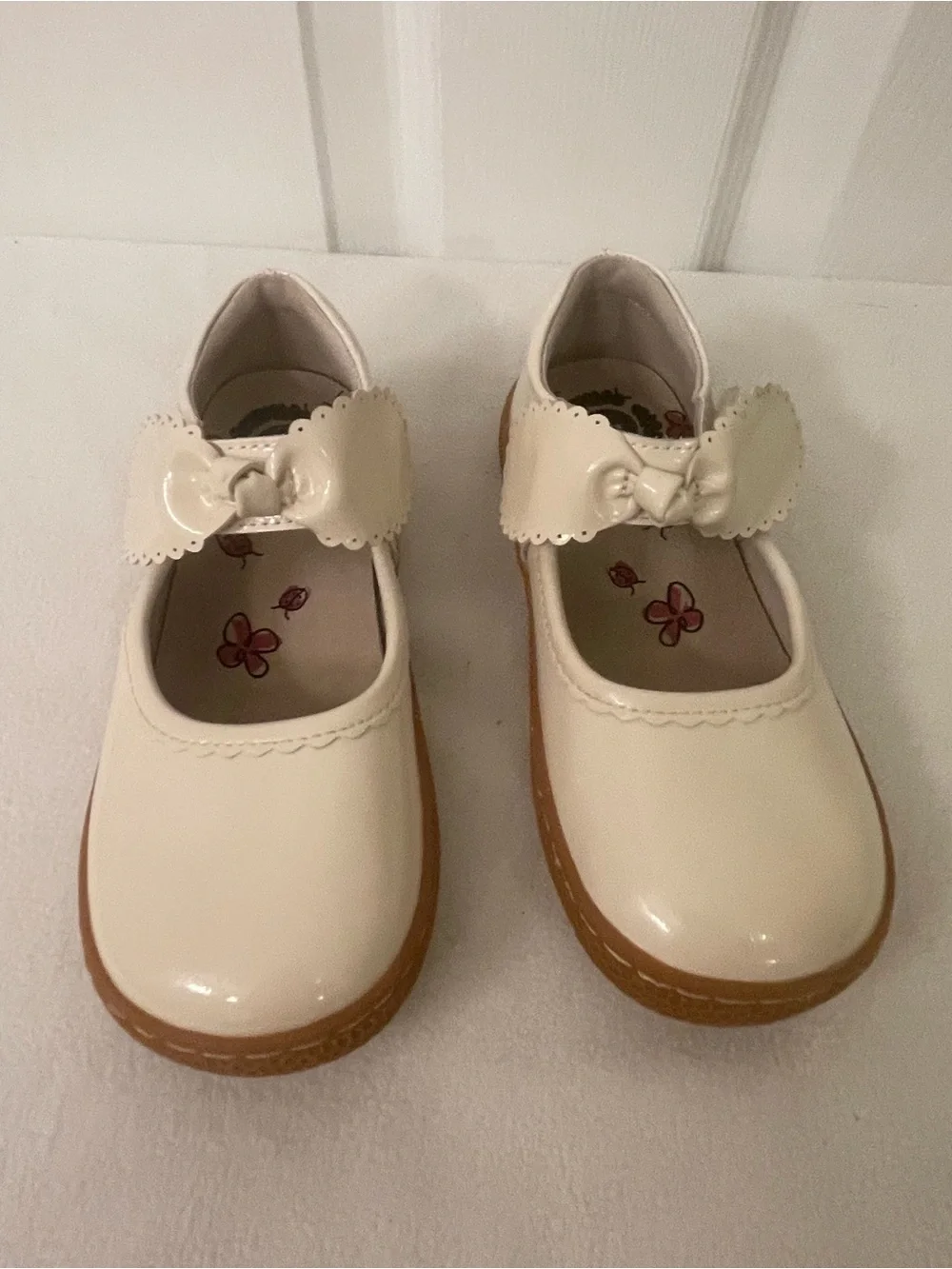 Livie & Luca Cream Patent Mary Jane Shoes with Bow Strap